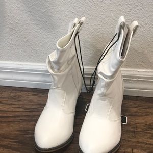 Size 9 white cowboy boots never been worn .